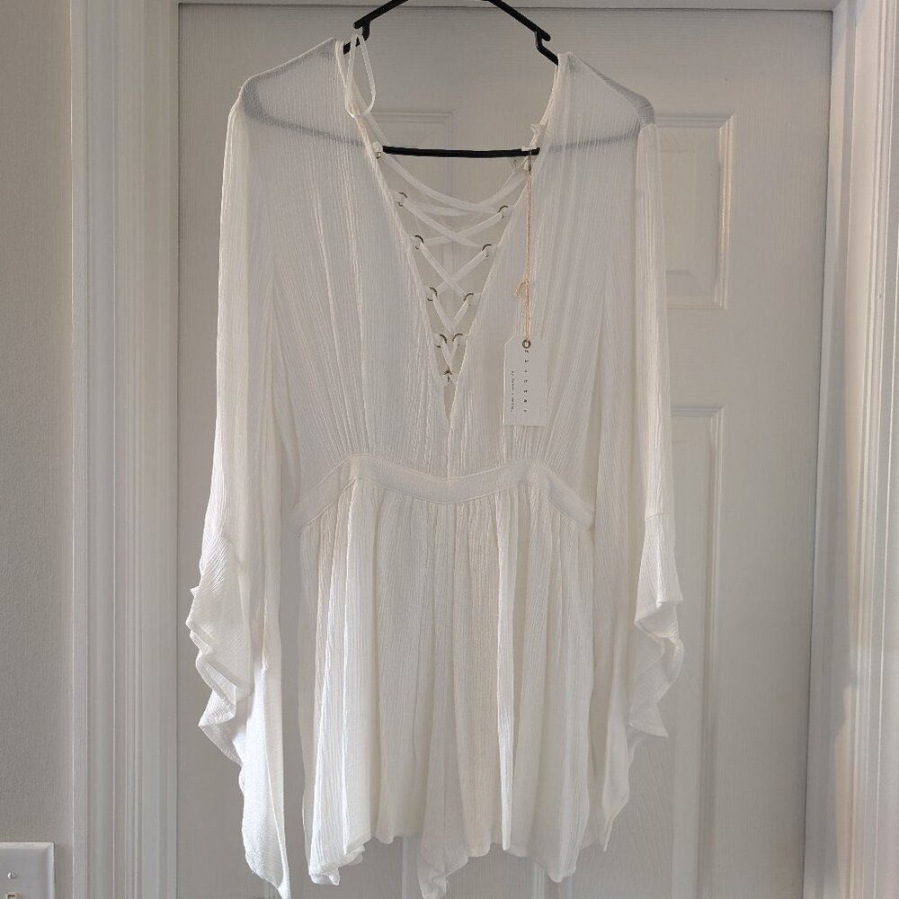 New tags on:  Off-white romper with criss cross top